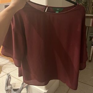 Maroon colored loose top with layered bell bottom sleeves